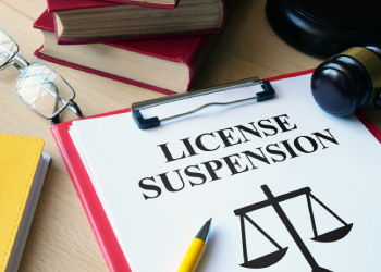 License Suspension file and Gavel in table