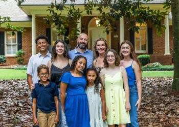 Happy blended family members in group photo