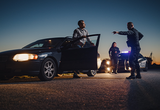 Professional Officer Ordering a Driver to Get Out of the Vehicle