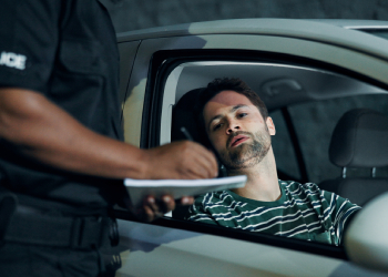 Man getting booked for traffic violation