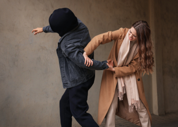 Woman defending herself from attacker
