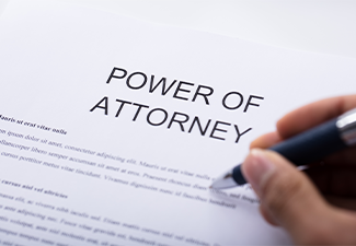 Person Filling Power Of Attorney Form