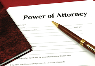 Power of Attorney Form ready to sign with book and pen