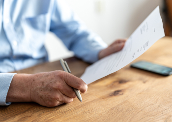 Elderly man reading an Advance Directive