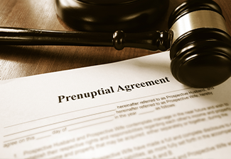 Prenuptial agreement form and gavel on the table