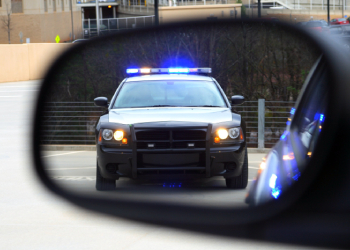 Police pulling over a car