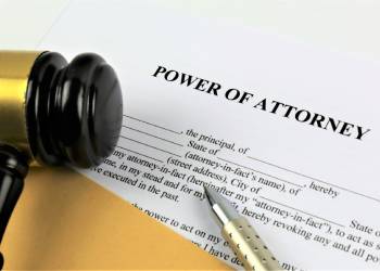 Power of Attorney Document with gavel in table