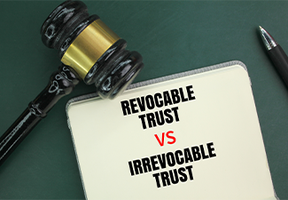 Judge's hammer, pen and book with the words Irrevocable Trust vs Revocable Trust