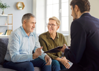 Old couples consulting with attorney for estate planning