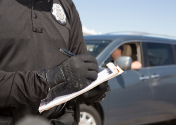 Police Officer writing a speeding ticket