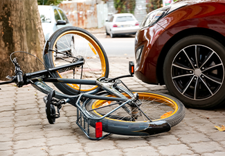 Accident between car and bicycle on city street