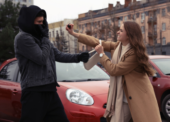 Women defending herself against robber