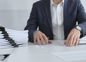 Man sorting through document for accounting