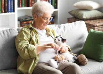 Old women with her pet cat