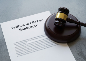 Petition for bankruptcy and gavel in table