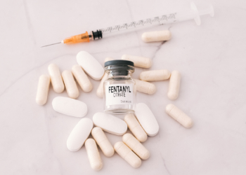 Vial of Fentanyl among syringe and tablets