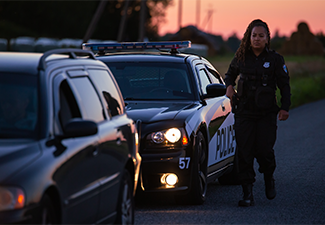 Highway Traffic Patrol Car Pulls over Vehicle on the Road