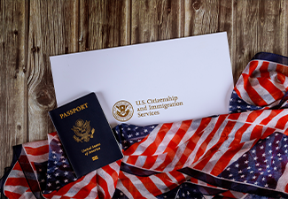 USA passport and naturalization certificate of citizenship US flag over wooden background