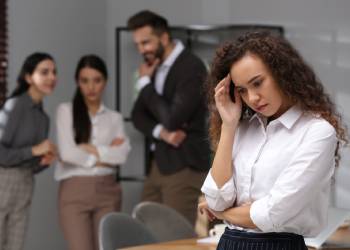 Woman suffering from racial discrimination at work