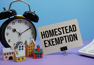 Homestead Exemption phrase with Calculator, alarm clock, Model