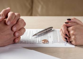 Couples signing divorce papers