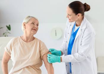 Old women getting medical care from doctor