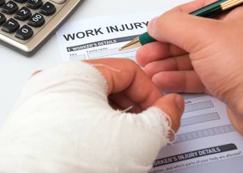 Man, filling work injury claim form