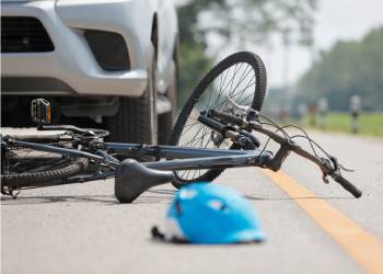 Bicycle is hit by car in road accident