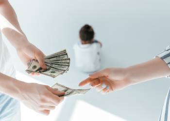 Man giving spousal support money to ex wife