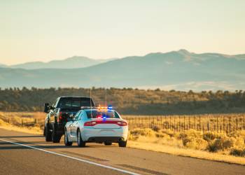 Police pull over a car
