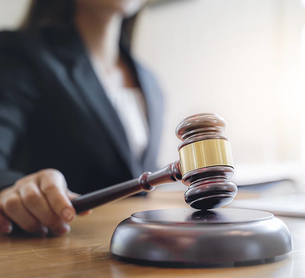Female attorney holding a gavel
