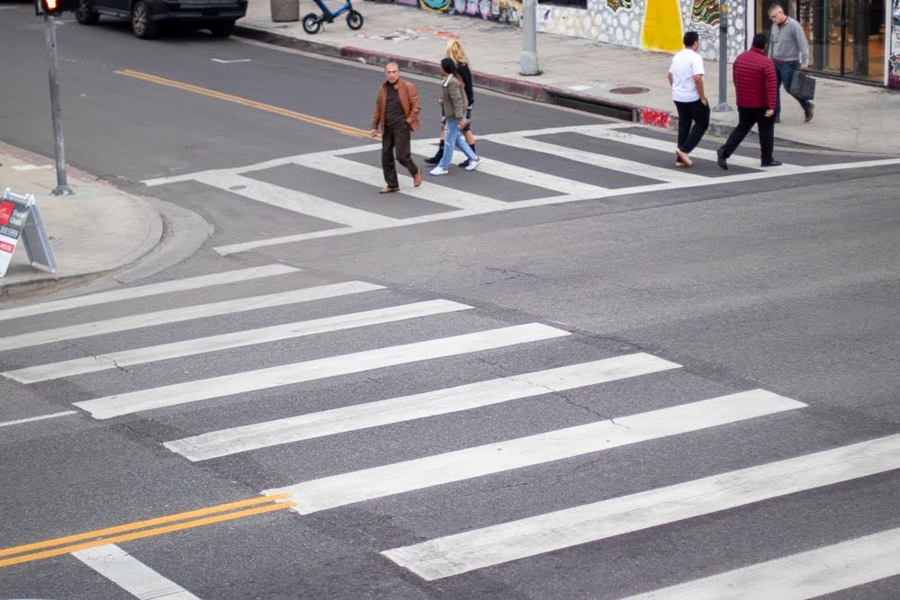 people at a cross walk