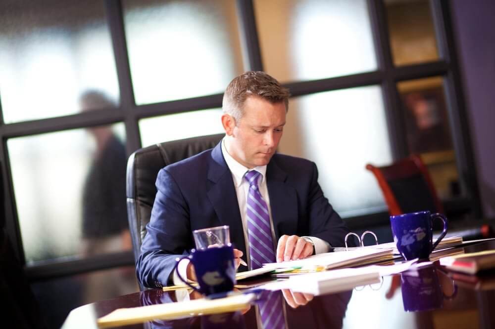 Attorney E. Ray Critchett Sitting in an Office