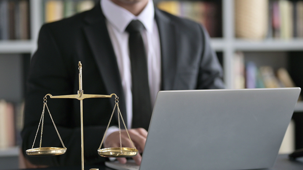 Close up Shoot of Lawyer Hand using Laptop in Court Room