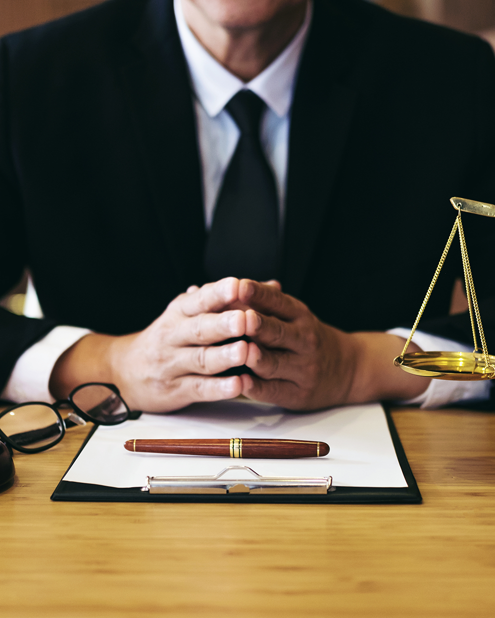 attorney in desk, glass and contract paper in table
