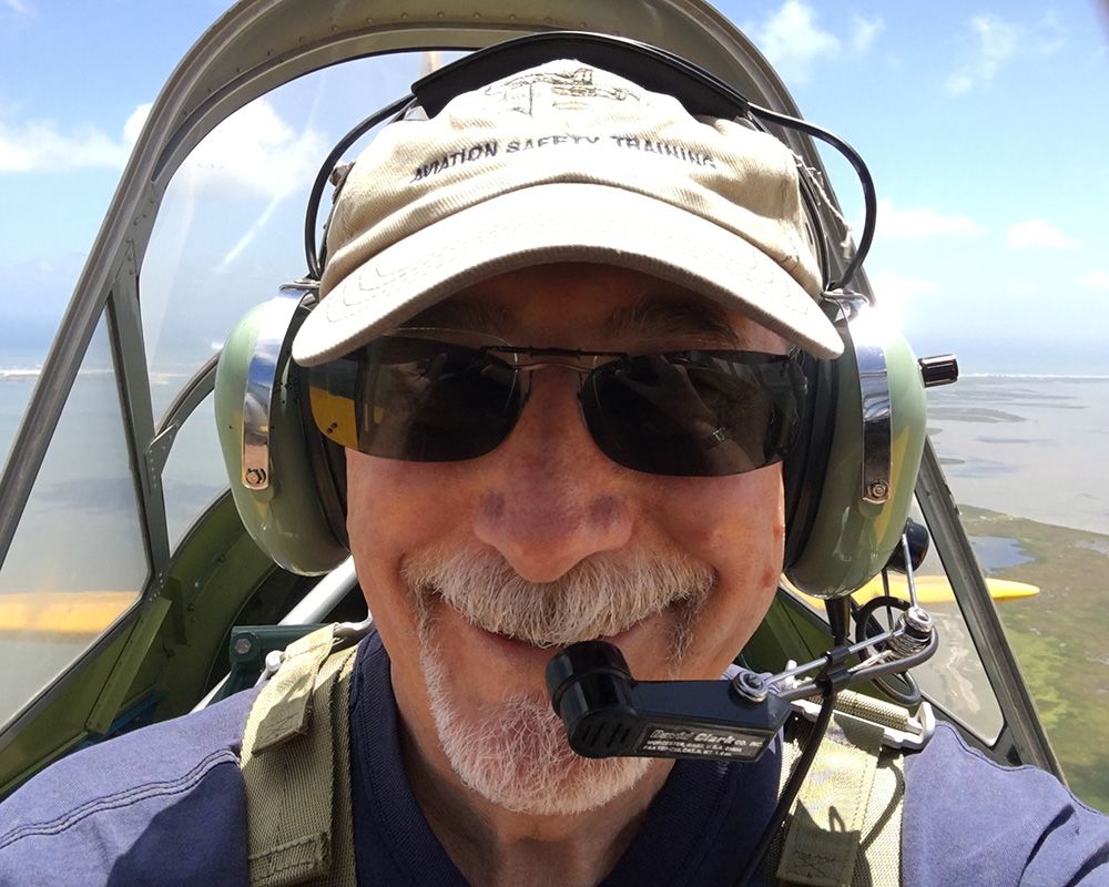 William "Bill" G. Harger flying a plane.
