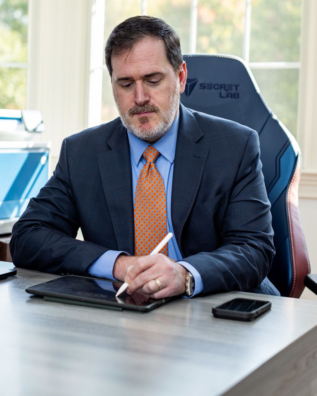 Scott Hirsch working at his desk.