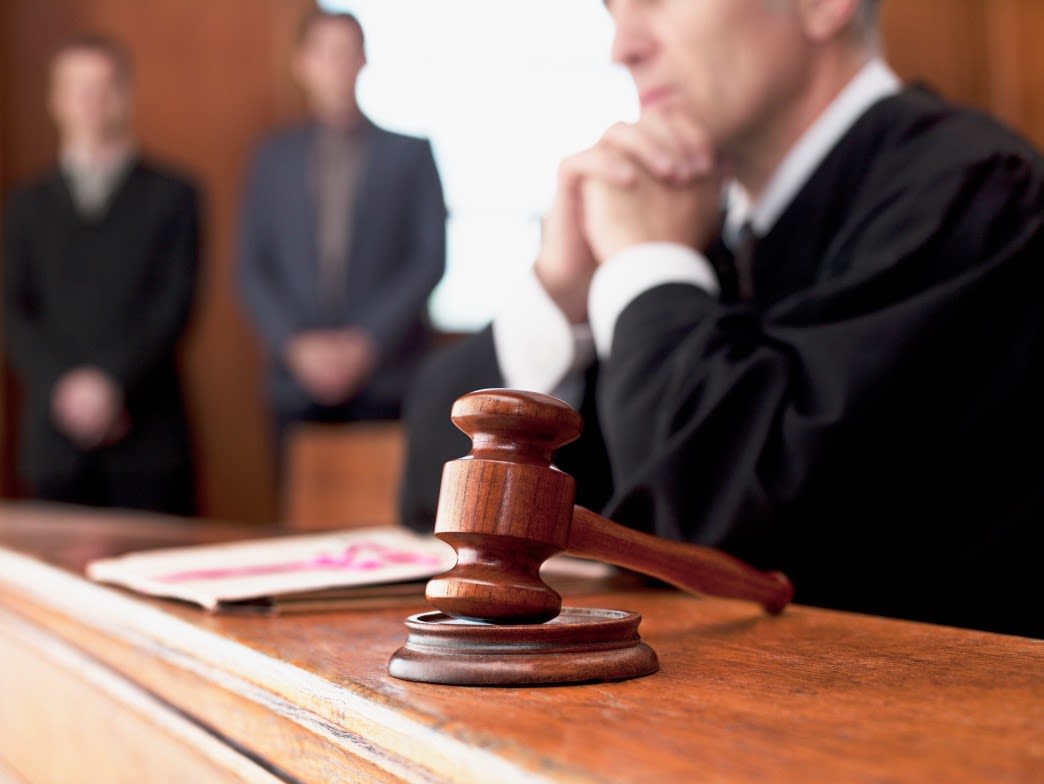 Judge crossing hands