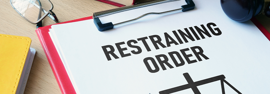 Restraining order is shown using the text with gavel