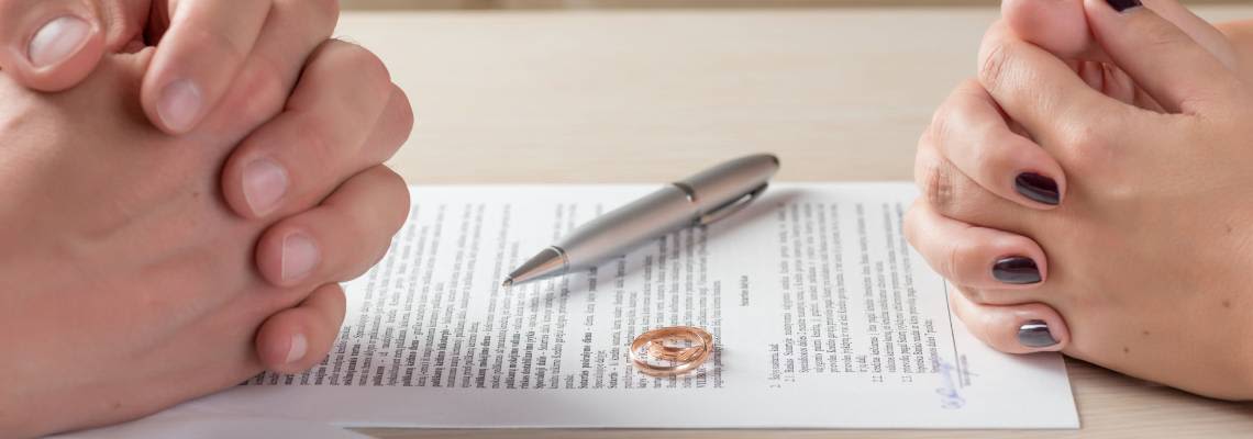 Couples signing divorce papers
