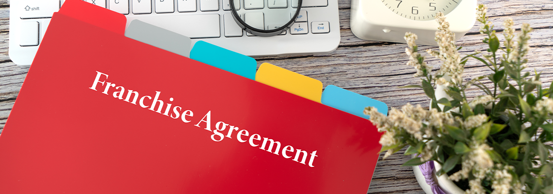 Franchise Agreement Document on the Table
