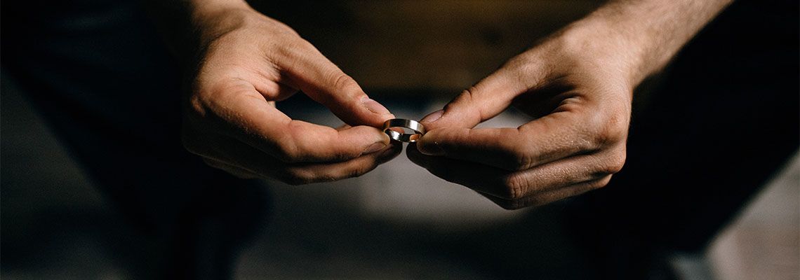 Man holding ring in hand