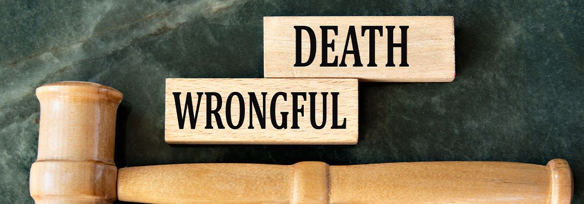 WRONGFUL DEATH words on wooden blocks along with gavel