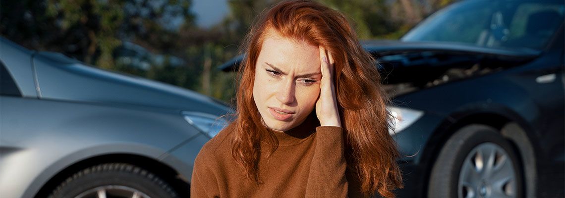 Woman suffering pain after car accident