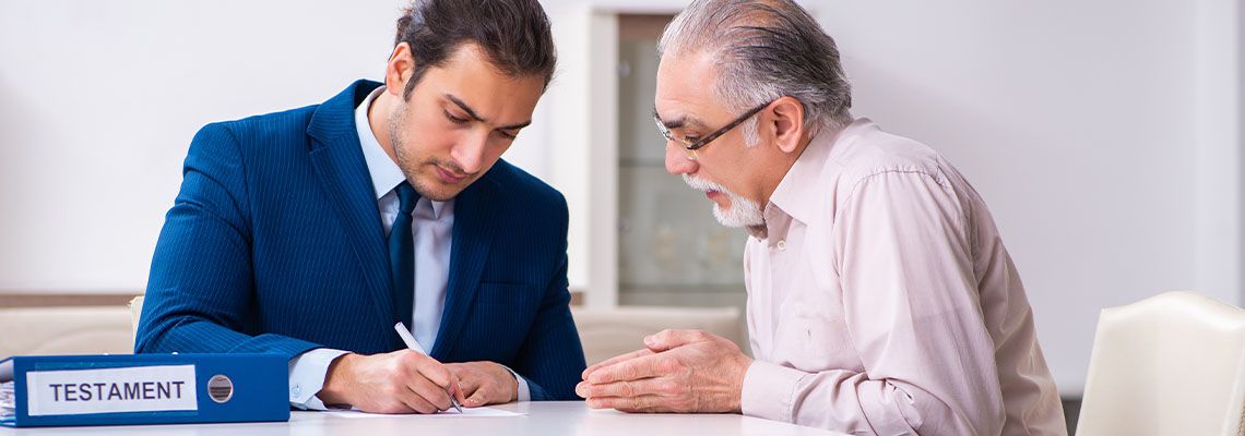 Lawyer visiting old man to review estate plan document