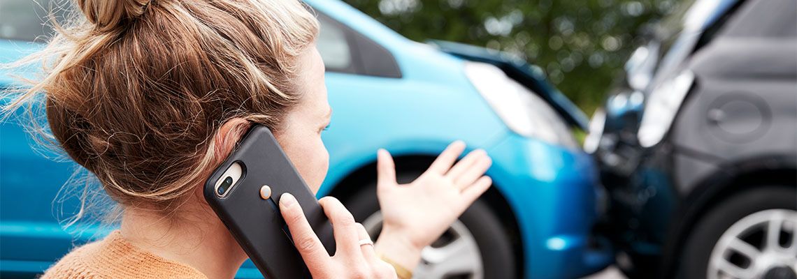 Woman Calling 911 after car accident