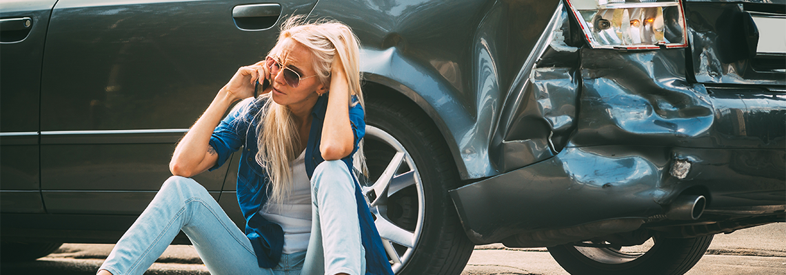 Girl Sits on The Road, Near the Broken Car and Calls on The Phone