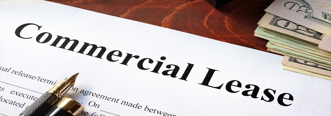 Commercial Lease Agreement with Money on A Table.