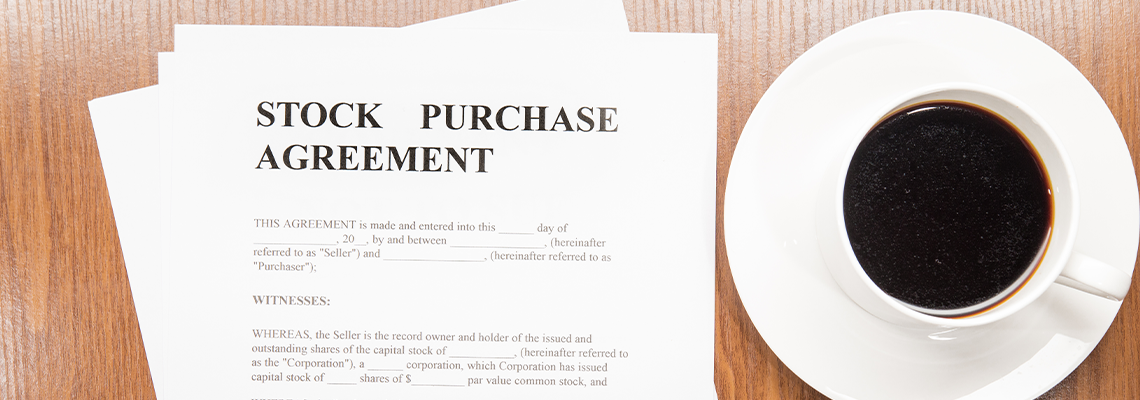 stock purchase agreement terms with a cup of coffee