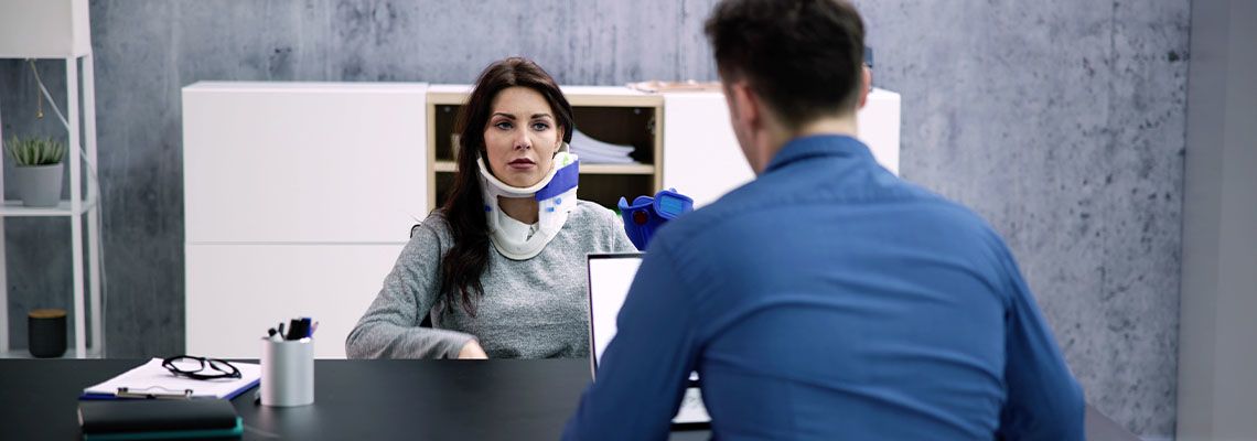 Injured woman with Insurance company representative